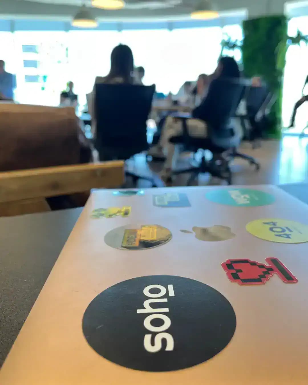 Soho team working together in an office setting